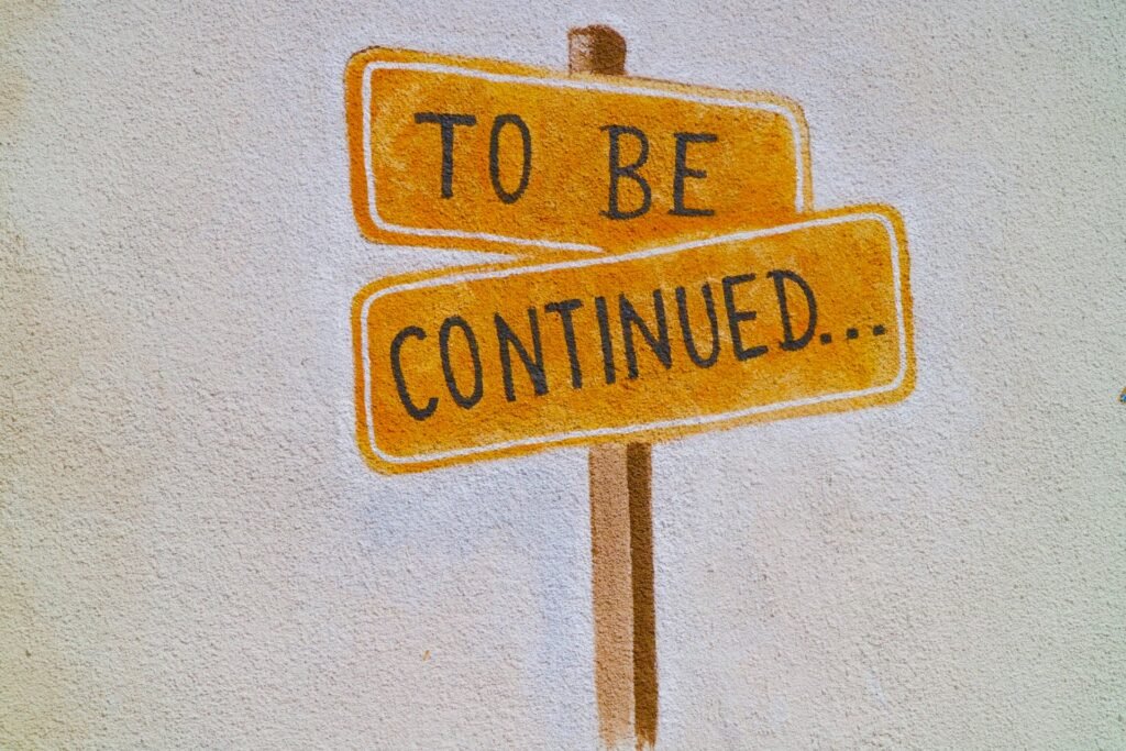 A hand-painted "to be continued" sign